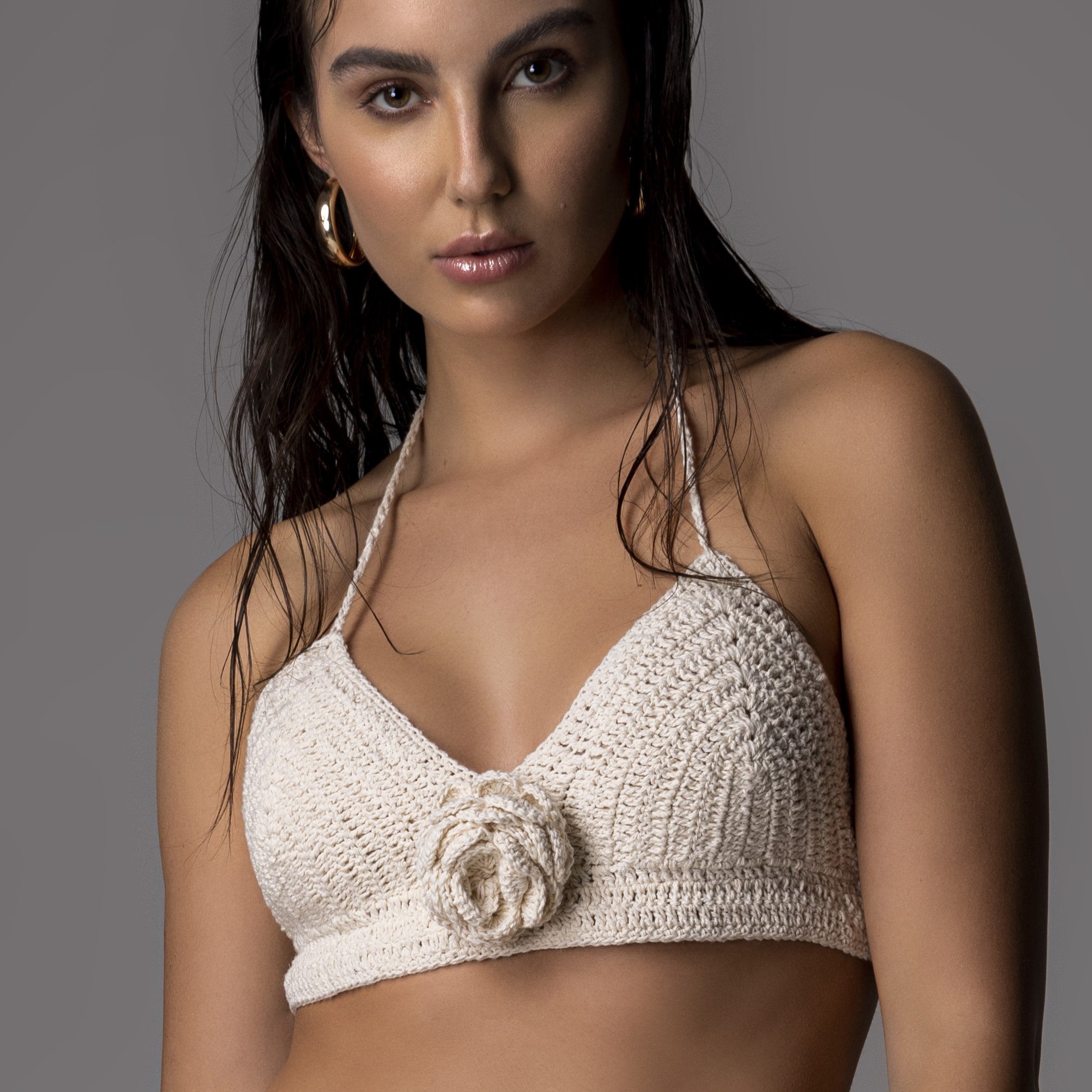 Close-Up of the model wearing the Love & Roses Top.